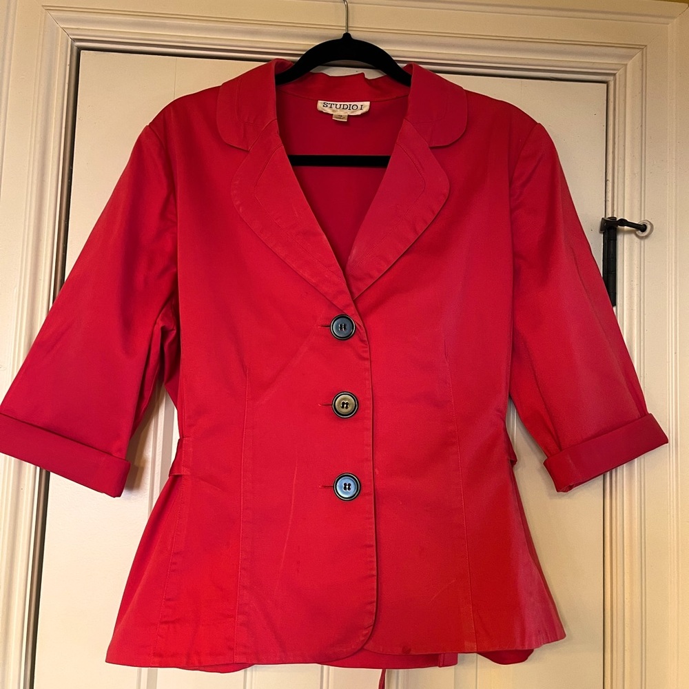 Coral color jacket with black buttons and 3/4 length sleeve